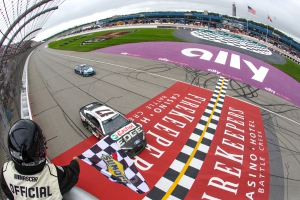 Chris Buescher, driver of the #17 for RFK Racing, takes the checkered flag to win the NASCAR Cup Series FireKeepers Casino 400 at Michigan Speedway on August 7, 2023, in Brooklyn, Michigan.  