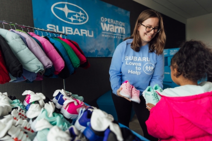 Subaru and Operation Warm provide coats, shoes and socks to homeless children