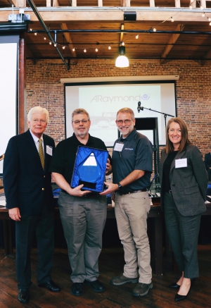 Pictured from left are: Brian Burton, President/CEO, Indiana Manufacturers Association; Larry Barker, Plant Manager at ARaymond Logansport; Doug Myers, Operations Manager at ARaymond; and Rachel Osting, 2023 Indiana Manufacturers Association Chair from Fort Wayne Metals, located in Fort Wayne.