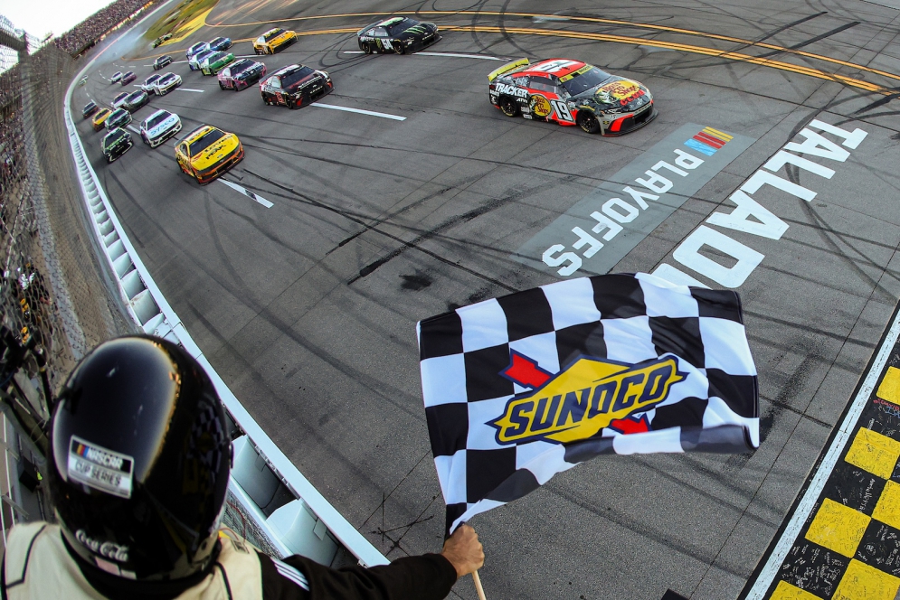 Chase Briscoe takes the checkered flag to win the YellaWood 500 at Talladega Superspeedway on October 19, 2025, locking his way into the Final Four who will battle for the Cup title at Phoenix next week.