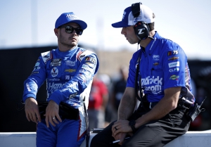 Kyle Larson, driver of the #5 car for Hendrick Motorsports, and crew chief Cliff Daniels talk on the grid during qualifying for the NASCAR Cup Series Championship at Phoenix Raceway on November 4, 2023.