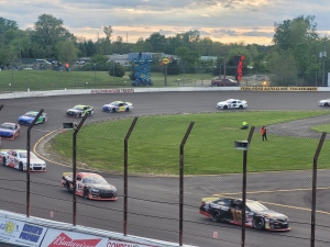 Max Reaves leads at Flat Rock Speedway on Saturday night, on the way to his third straight victory in the No. 18 Joe Gibbs Racing entry.