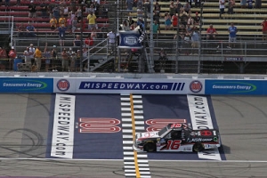 Austin Hill crosses the line first to win the NASCAR Gander Outdoors Truck Series Corrigan Oil 200 on Saturday at Michigan International Speedway.